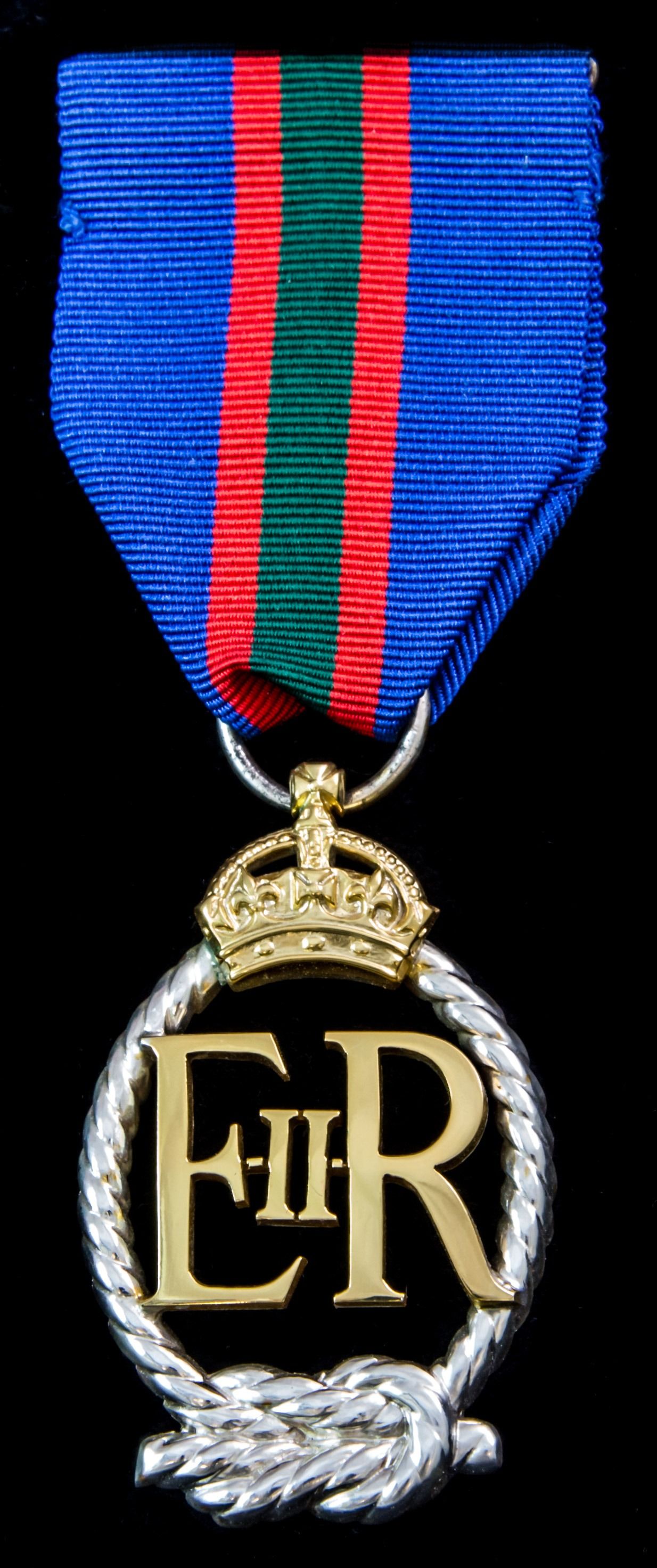 Royal Naval Volunteer Reserve Decoration, EIIR cypher, reverse dated 1964 in fitted Royal Mint ca...