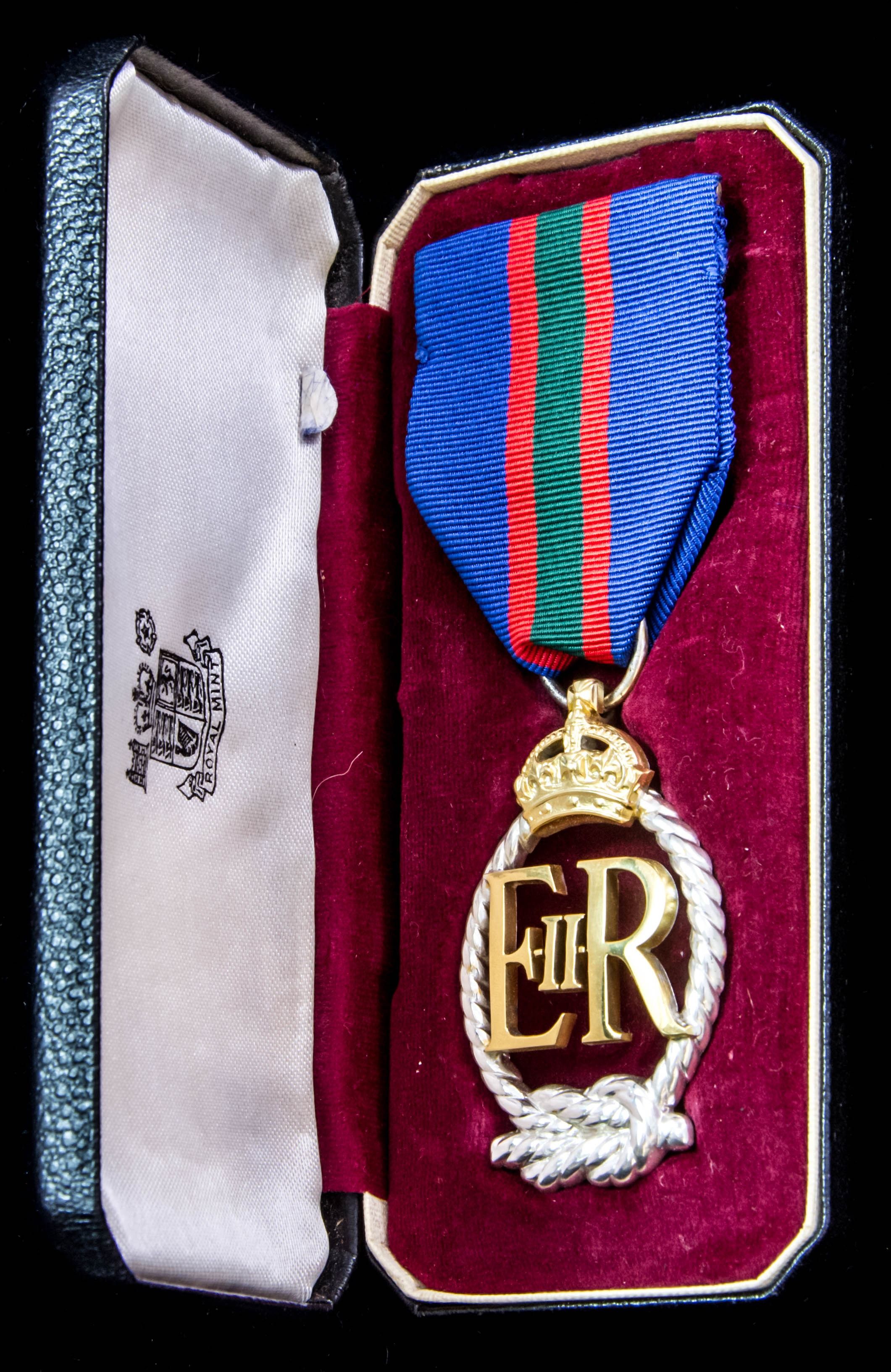 Royal Naval Volunteer Reserve Decoration, EIIR cypher, reverse dated 1964 in fitted Royal Mint ca...
