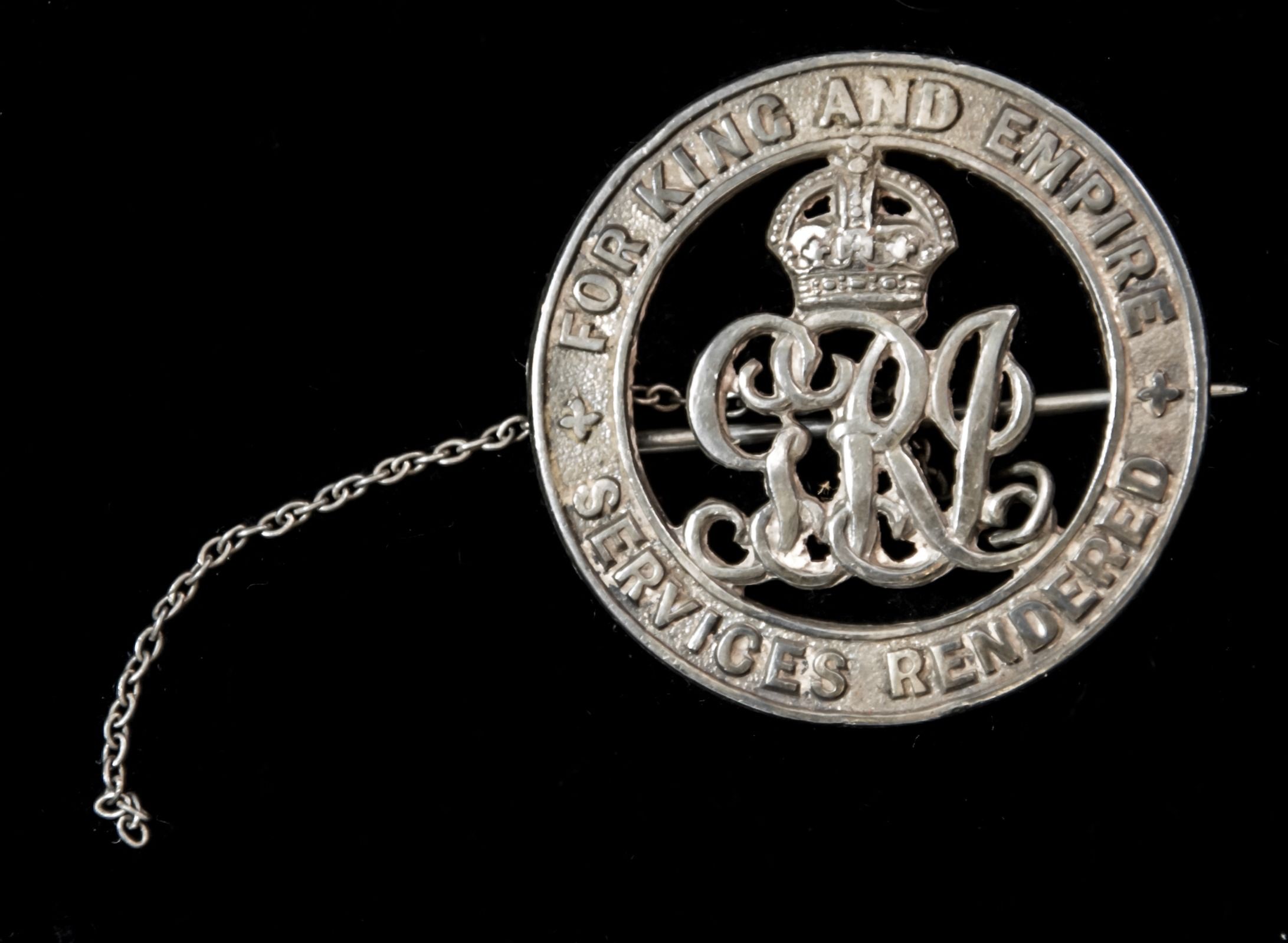 Silver War Badge, reverse numbered ‘84208’, together with a partial safety chain, and housed in i...