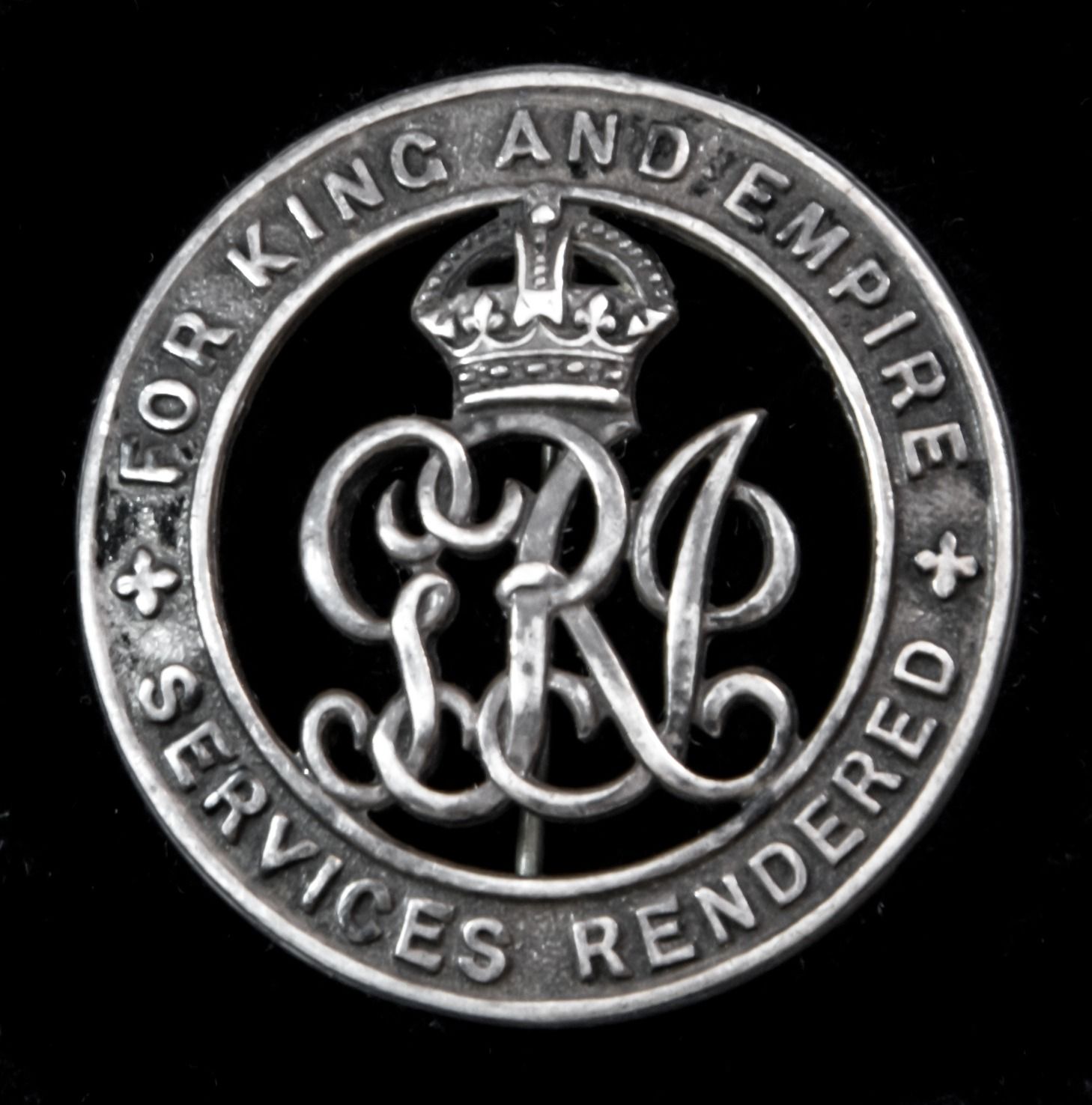 Silver War Badge, the reverse numbered ‘427391’ awarded to Private G.J. Lee, East Lancashire Regi...